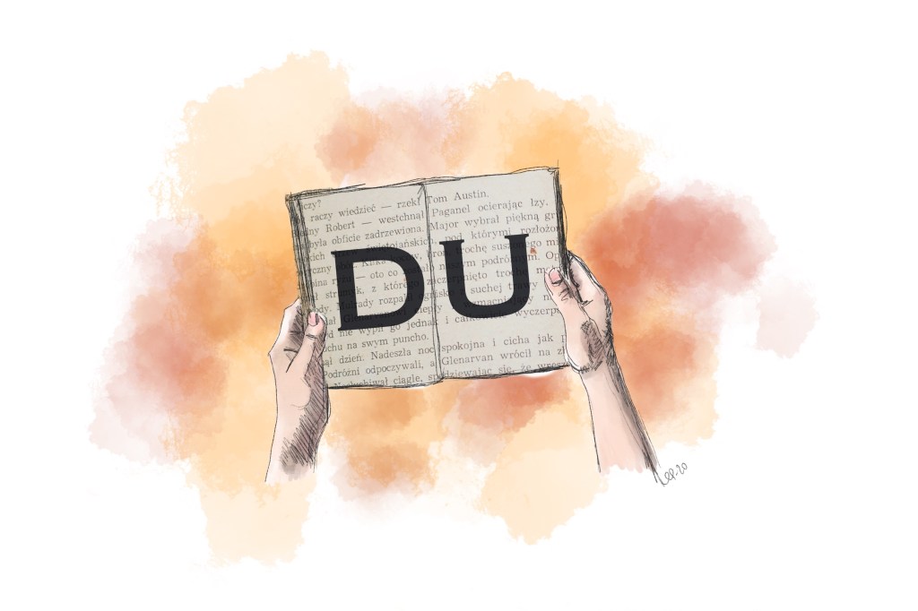 Händer som håller en bok med texten "DU".